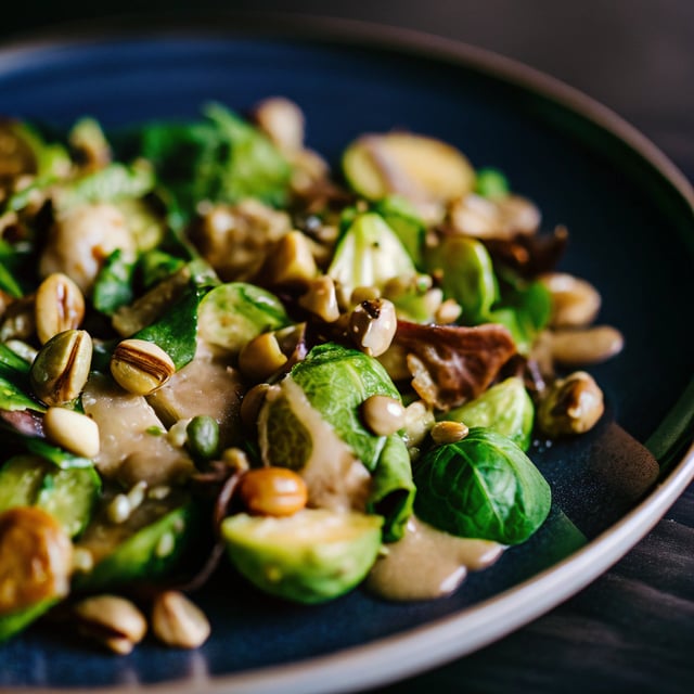 Lemony Brussel Sprout Salad with Pistachios and Tahini Sauce