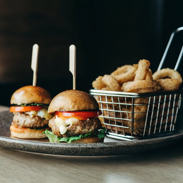Kickin' Cajun Chicken Sliders with Beer Battered Onion Rings.